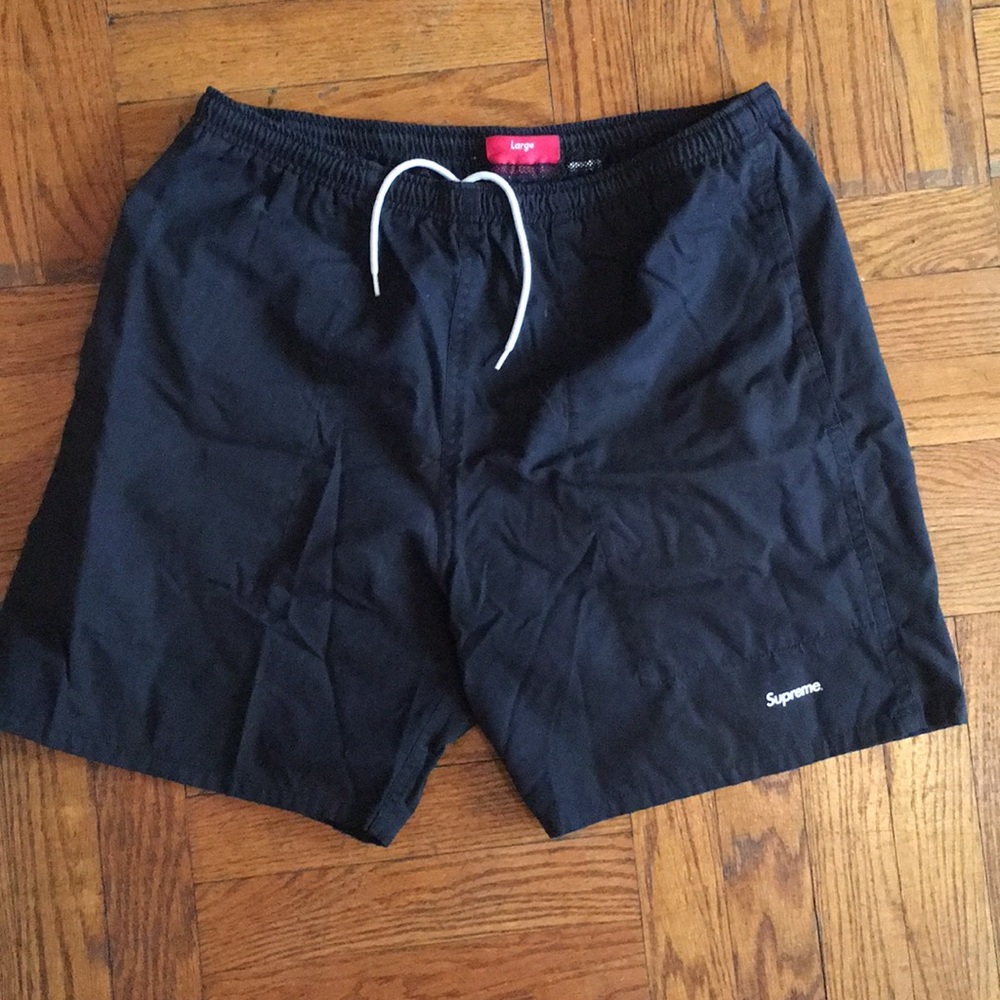 Supreme swim trunks